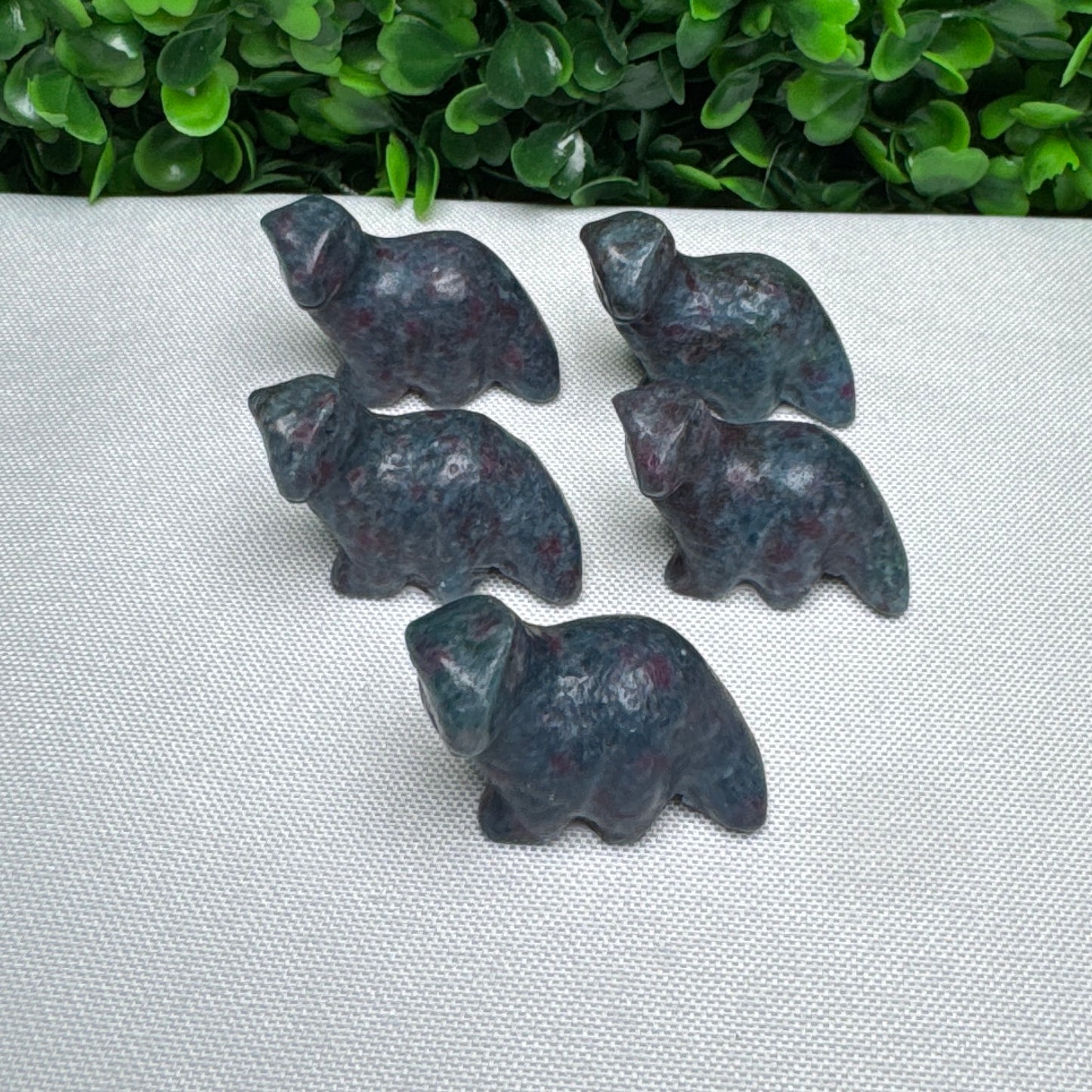 Intuitively chosen mini Ruby and kyanite Dino carving