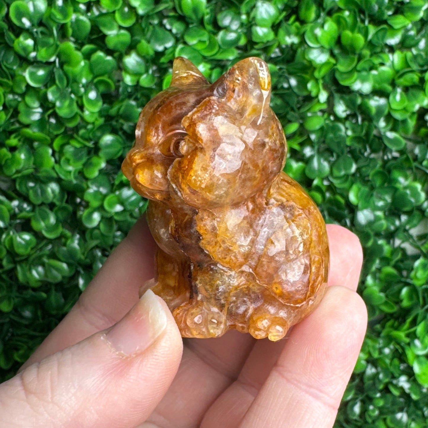 Golden healer cat carving