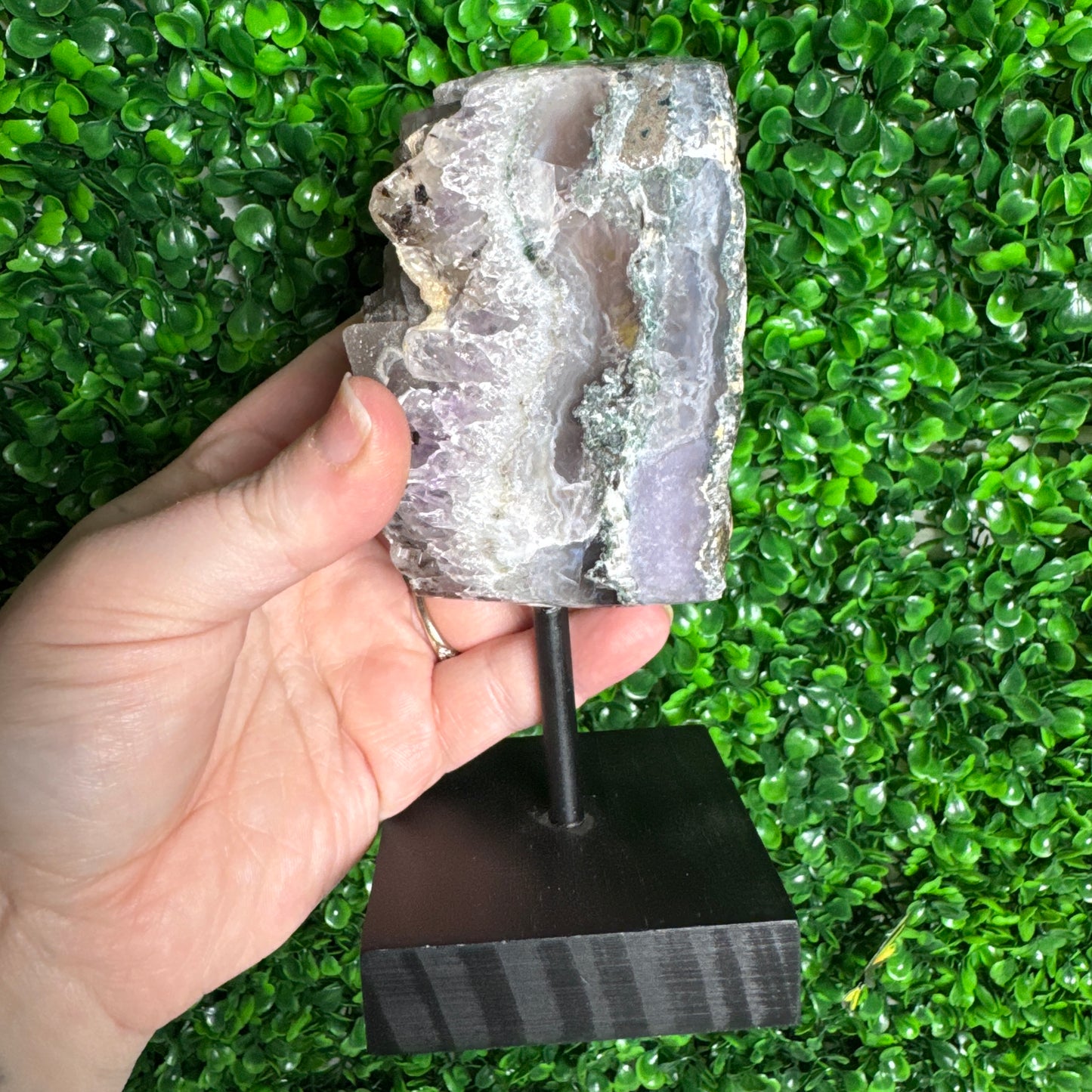 Sugar amethyst piece on a stand