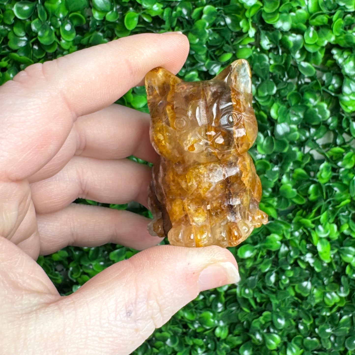 Golden healer cat carving